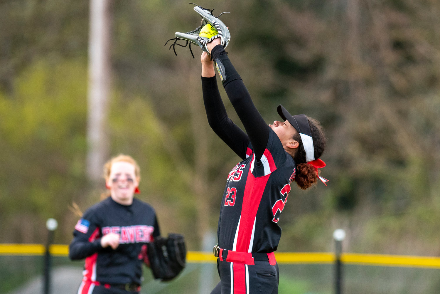 Tenino senior Alivia Hunter makes a catch on a flyball in right field against Elma at home on April 26.